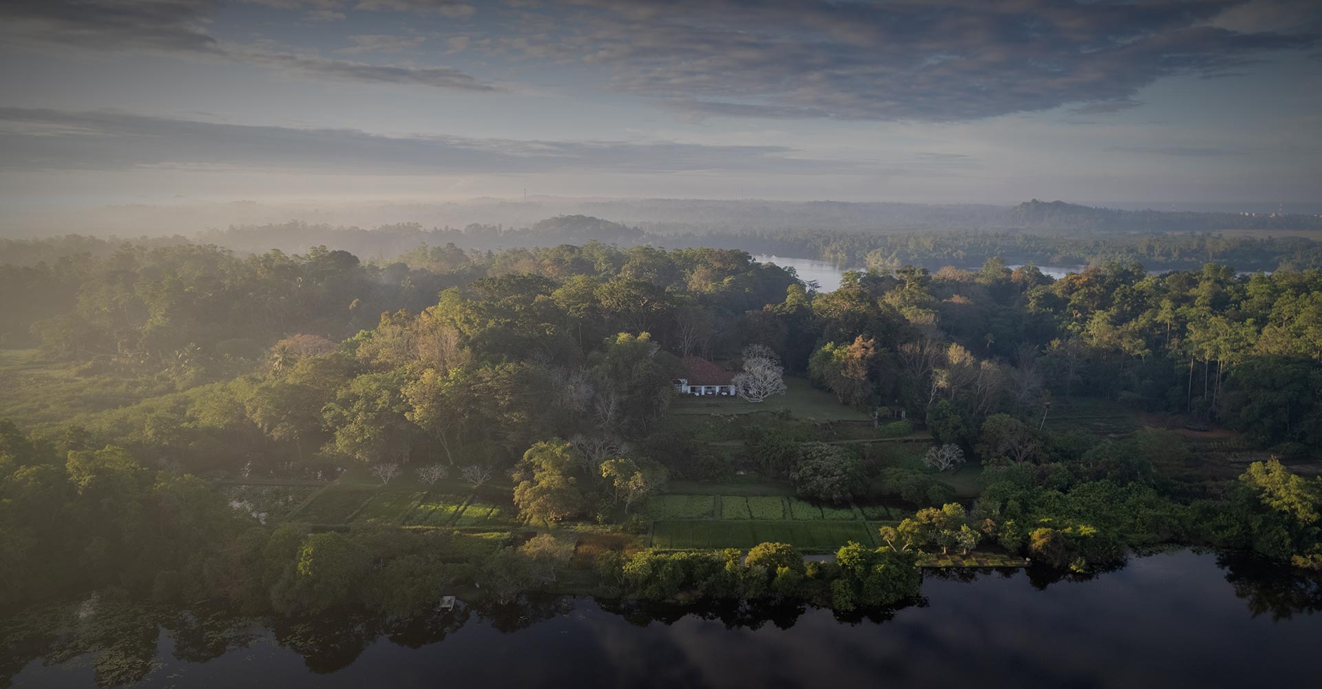 Lunuganga, a luxury boutique hotel in Bentota, Sri Lanka. Surrounded by nature and overlooking a lake.